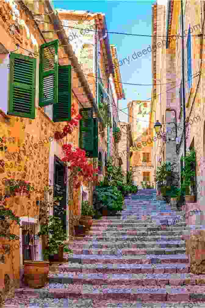 A Charming Street In The Village Of Deyá In Mallorca, With Traditional Mallorcan Houses And A Church Steeple In The Background Walk Mallorca West Charles Davis